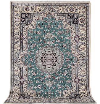 A Nain carpet, part silk, 9 laa, c. 300 x 201 cm.