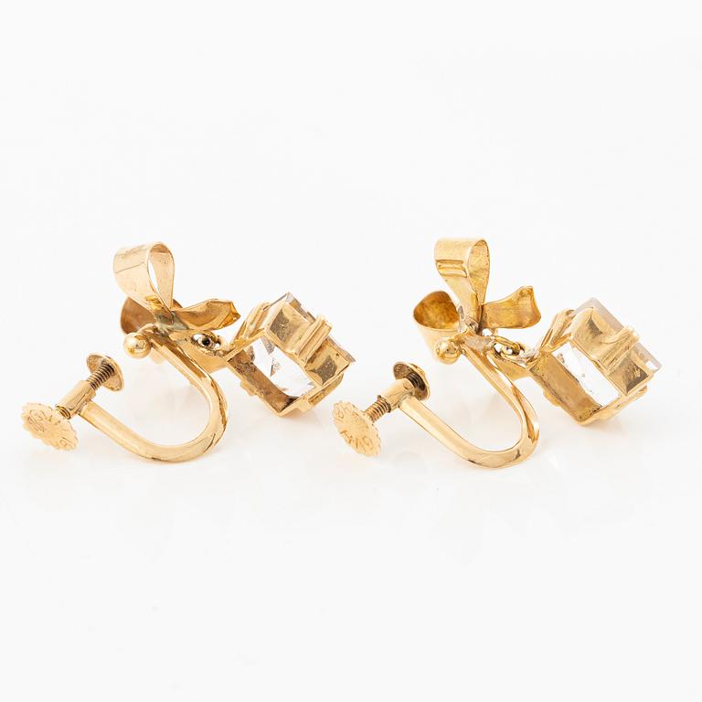 A pair of 18K gold earrings with faceted rock crystal.