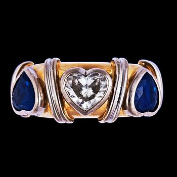 1252. A heart cut diamond and blue sapphire ring.