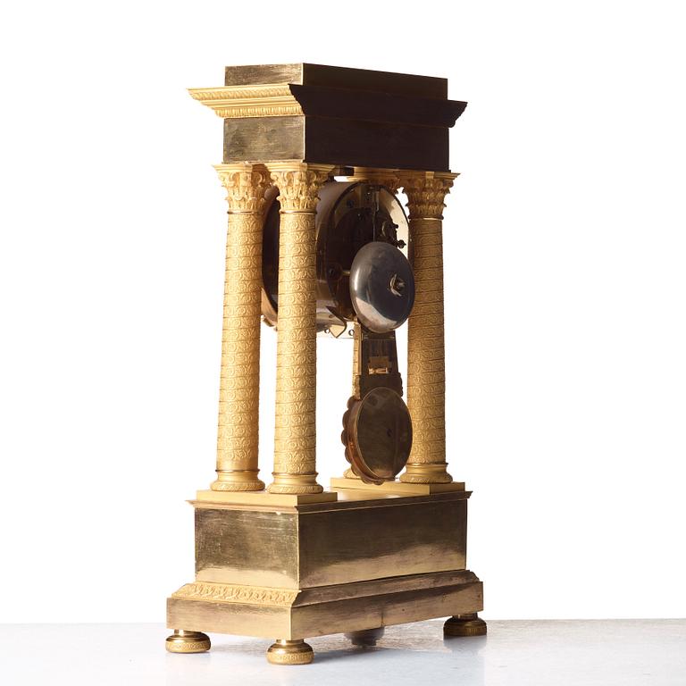 A Empire early 19th century gilt bronze mantel clock.