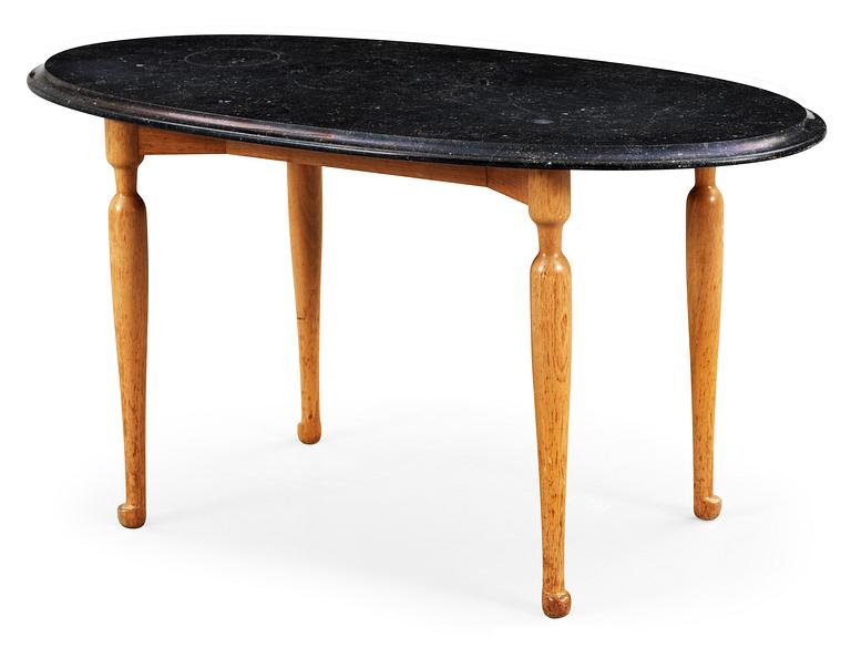 A Josef Frank black marble, mahogany and walnut table, Svenskt Tenn.