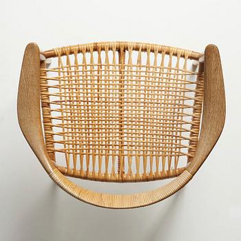 Hans J. Wegner, an oak and rattan 'The Chair', JH501, Johannes Hansen, Denmark.