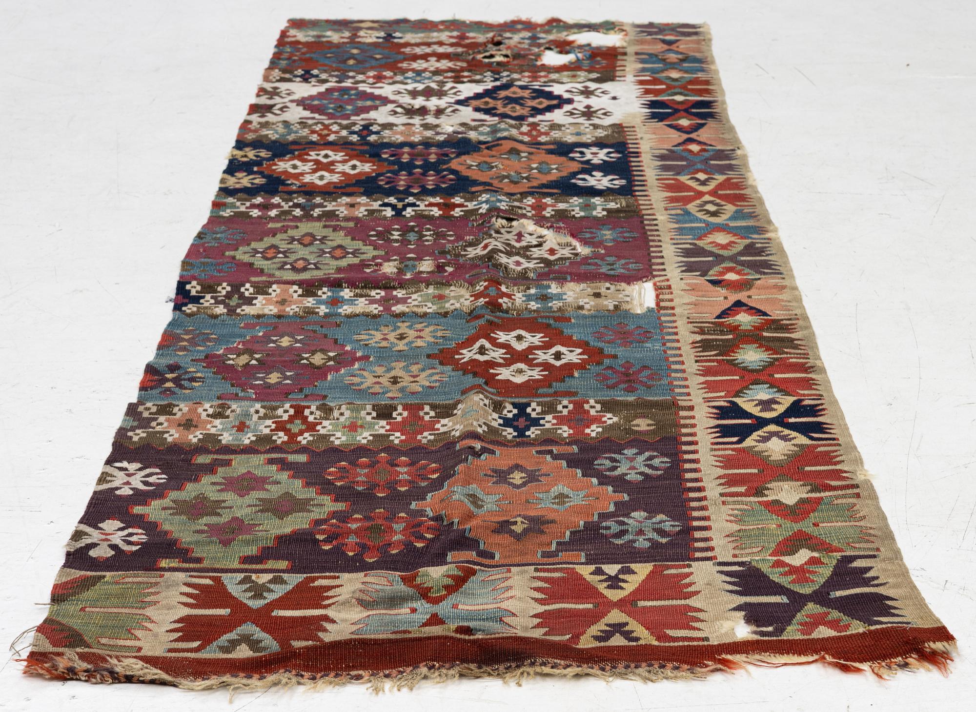 An antique kilim fragment, central Anatolia, c. 238 x 82 cm.