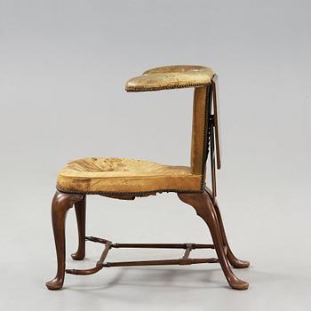 An English 18th century reading and writing chair.