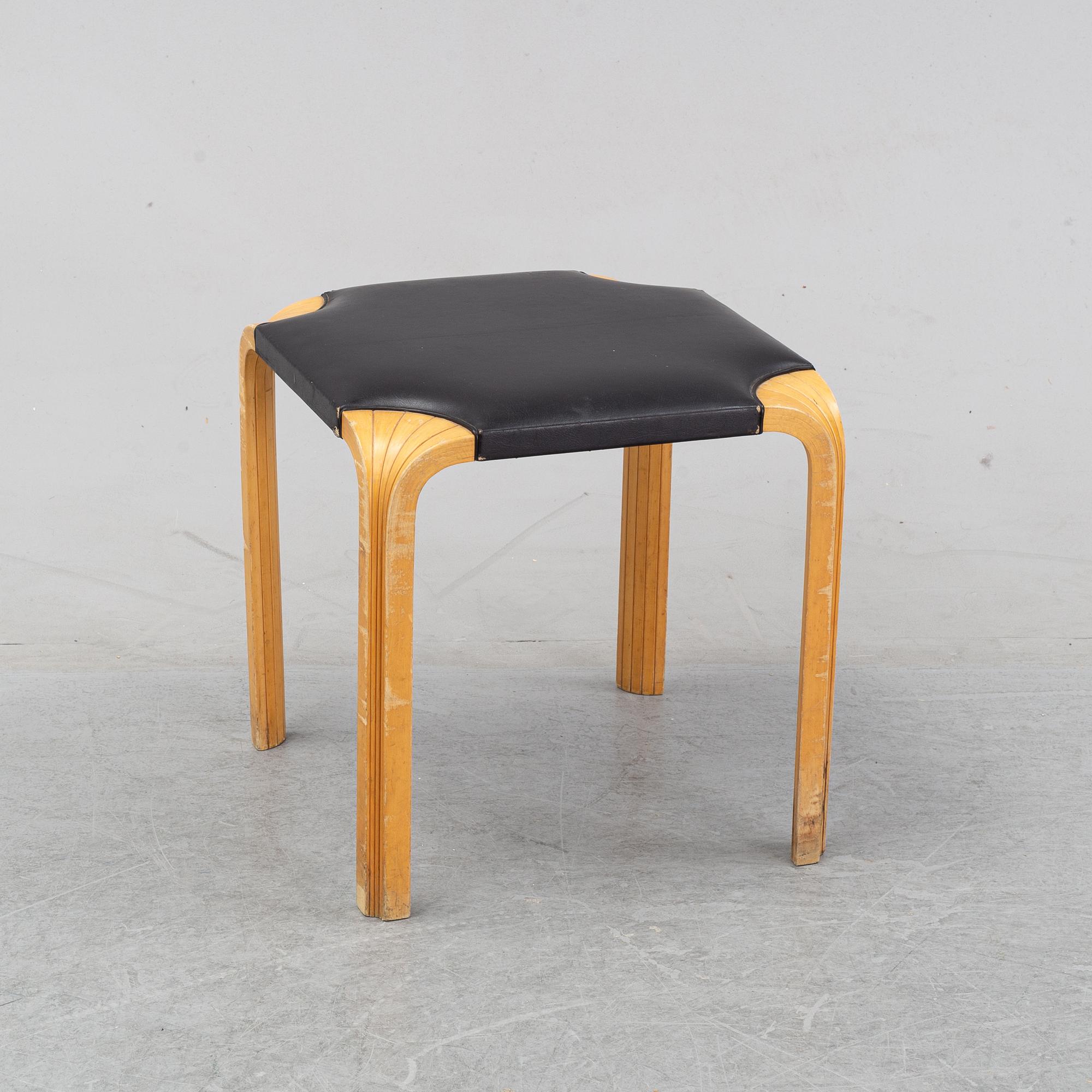 Alvar Aalto, a birch and leather stool, Artek, second half of the 20th century.