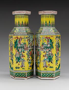 A pair of yellow ground famille verte vases, Qing dynasty, 19th Century, with Qianlong´s four character mark.