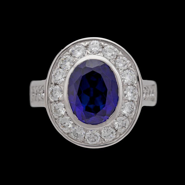 A blue sapphire and brilliant cut diamond ring, tot. 1.50 cts.