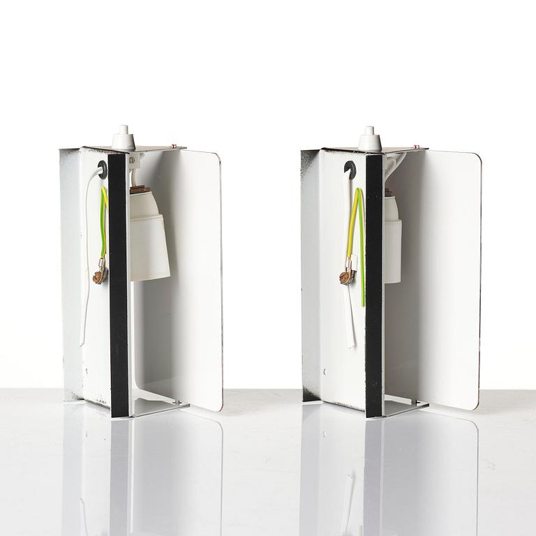 Charlotte Perriand, a pair of wall lights model "CP1", La Société Centrale d'Eclairage, France, 1960s.