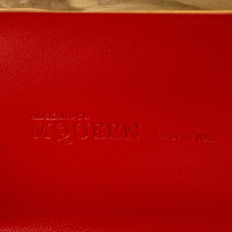 ALEXANDER MCQUEEN, a red nubuc leather "Knucklebox Clutch".