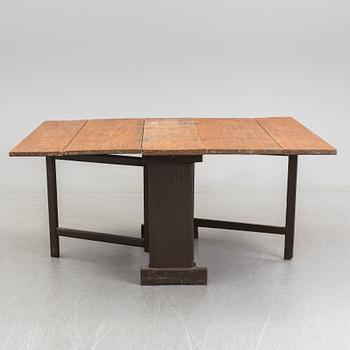 A mid 19th century gate leg table.