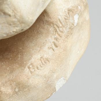 two plaster figurines, signed.