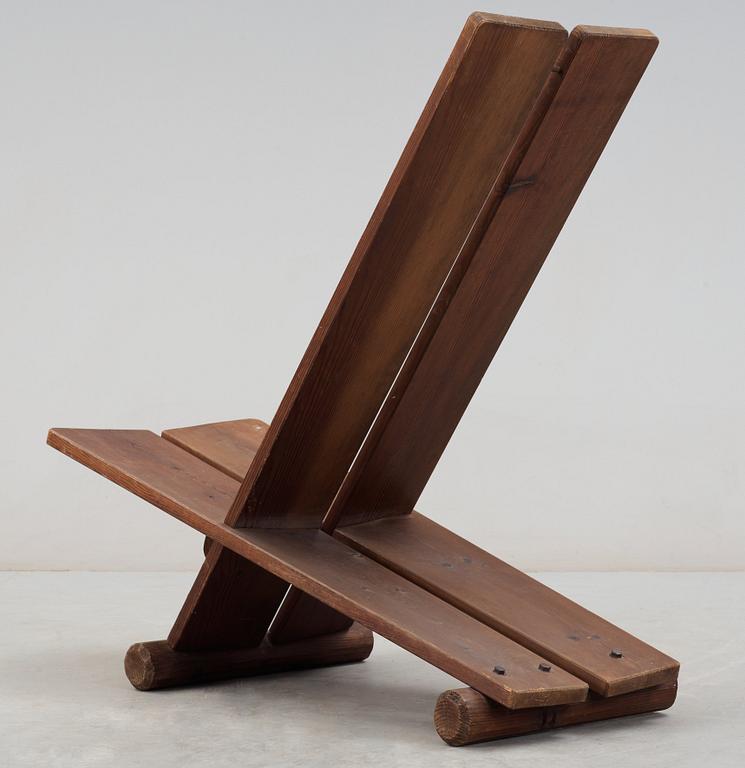 An Axel Einar Hjorth stained pine easy chair, Nordiska Kompaniet (NK) 1930's.