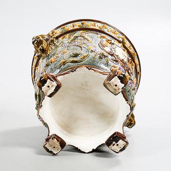 A pot on a pedestal in ceramics made by Rörstrand in the years between 1884-1890.