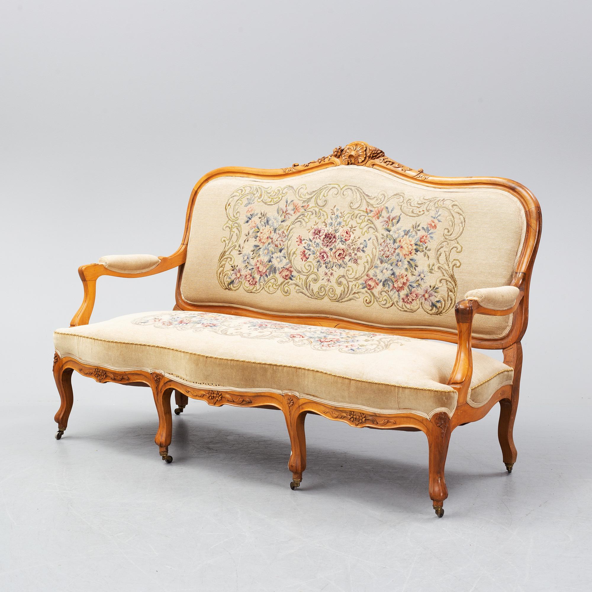 A set of sofa, two armchairs and six chairs, Louis XV-style, ca 1900.