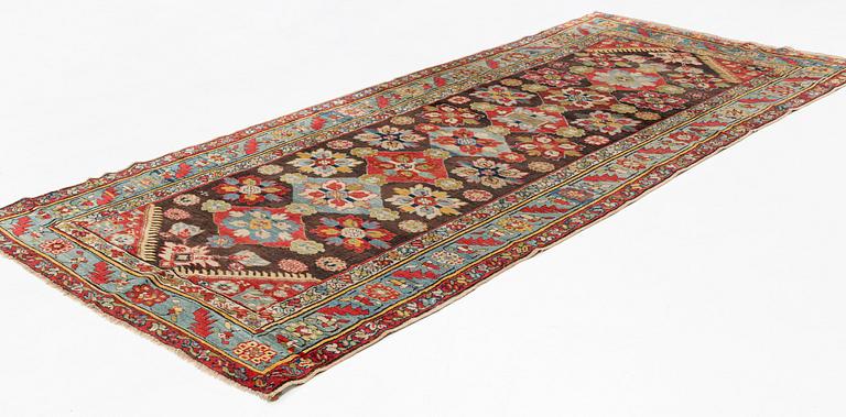 An antique Karabagh carpet,  ca 330 x 157 cm (one end with 1-3 cm flat weave).