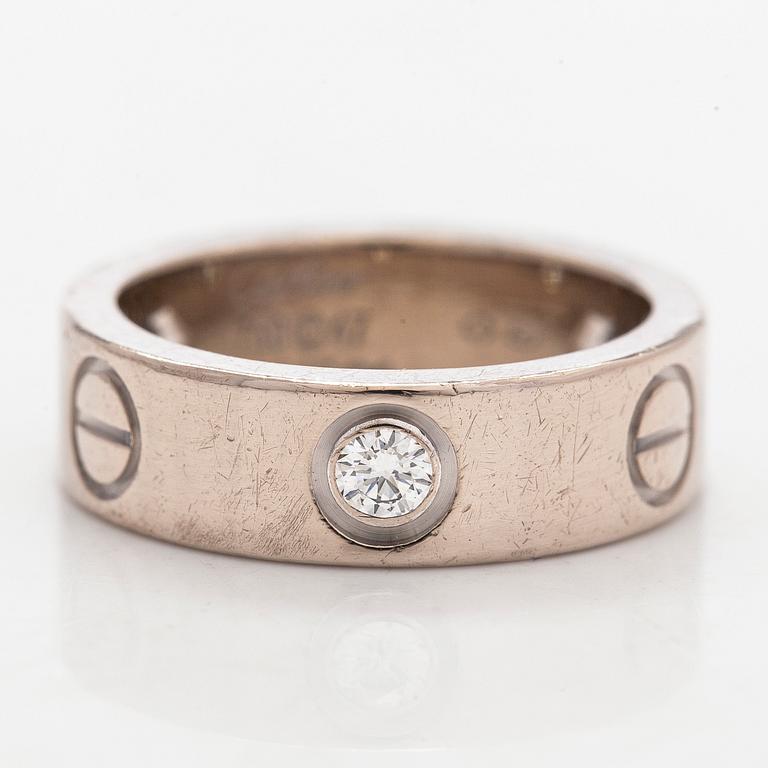 Cartier, an 18K white gold 'Love' ring with three brilliant-cut diamonds.