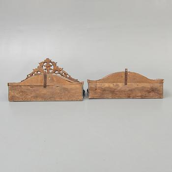 Two painted and carved wooden clothes hangers, Indonesia, 20th Century.