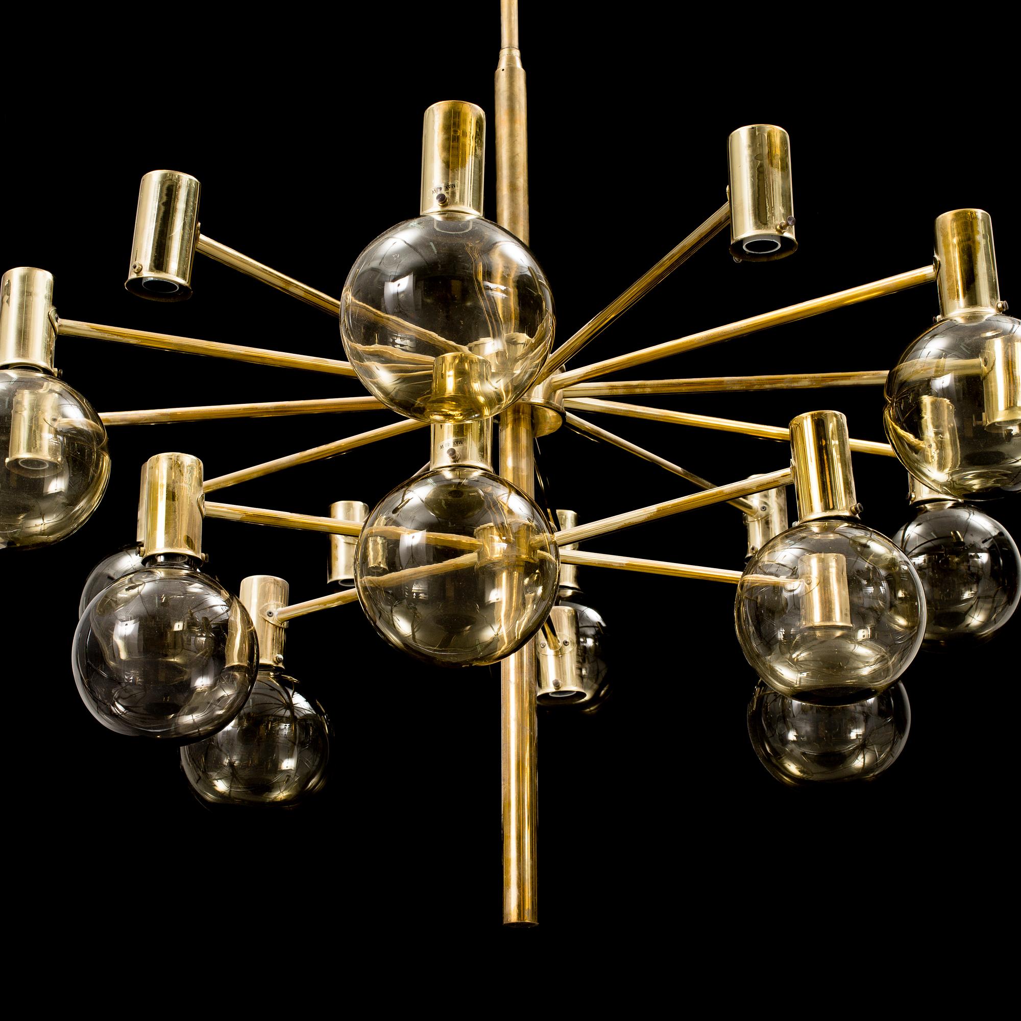 A 20th century brass and smoked glass chandelier by Hans Agne Jakobsson, Markaryd, Sweden.