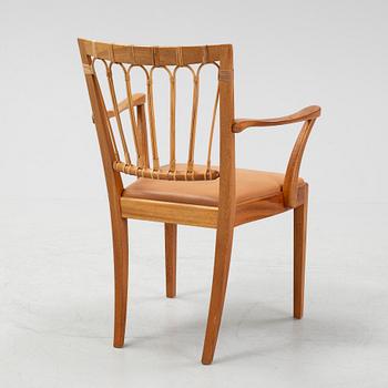 A model 1165 armchair by Josef Frank for Firma Svenskt Tenn.