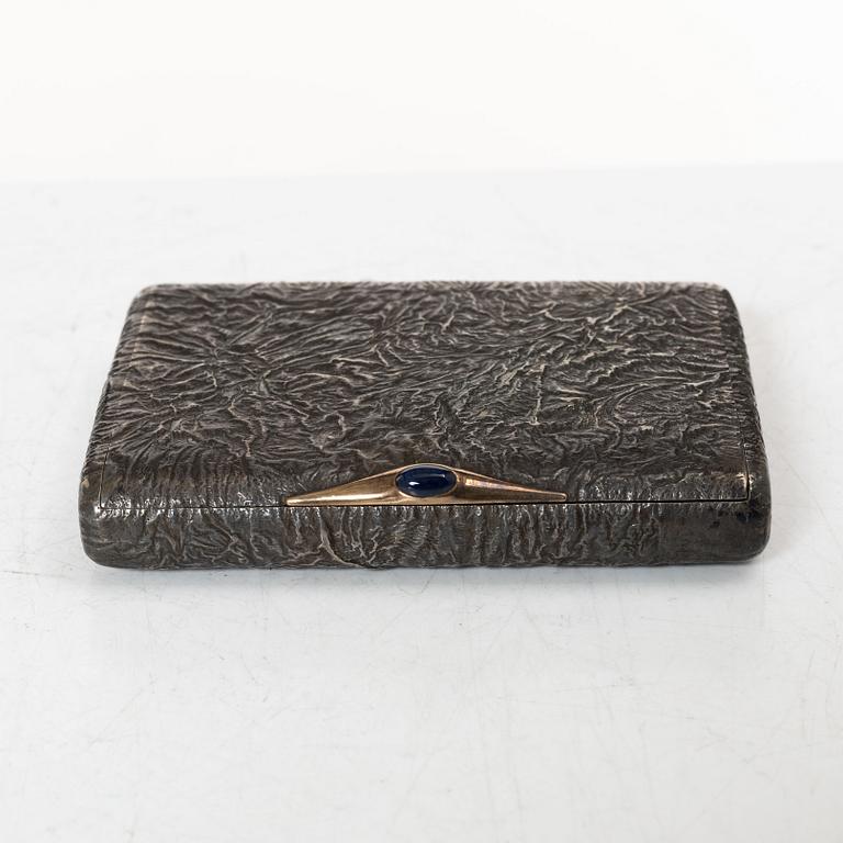 A Russian silver samorodok cigarette case, St. Petersburg 1908-17, unidentified maker's mark, possibly Ivan Arkarov.