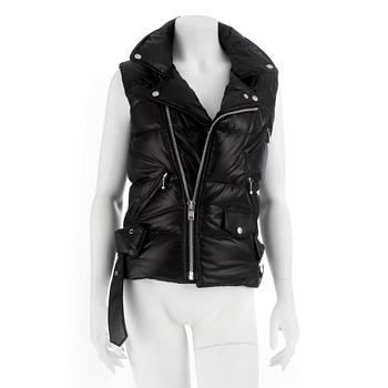 644. JUNYA WATANABE Comme des Garçons, a black down filled vest with leather details, size S.