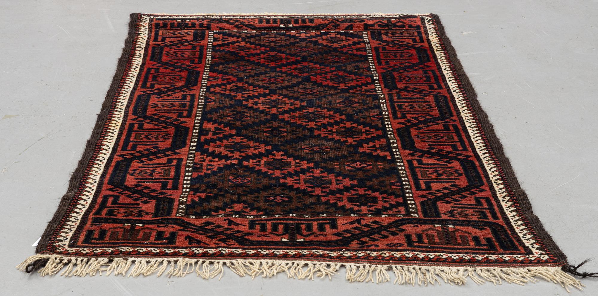 A rug, antique Baluch, ca 193 x 103 cm.