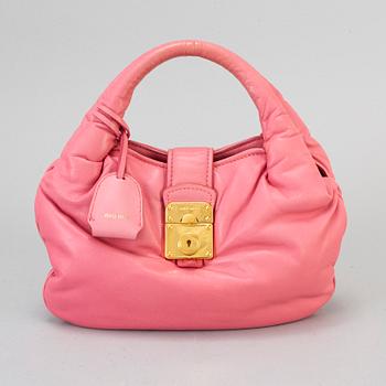 MIU MIU, a pink leather bag.