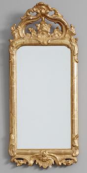 135. A rococo mirror, 18th Century.