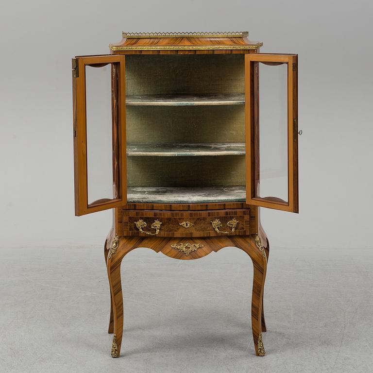 A late 19th century rococo style cabinet.