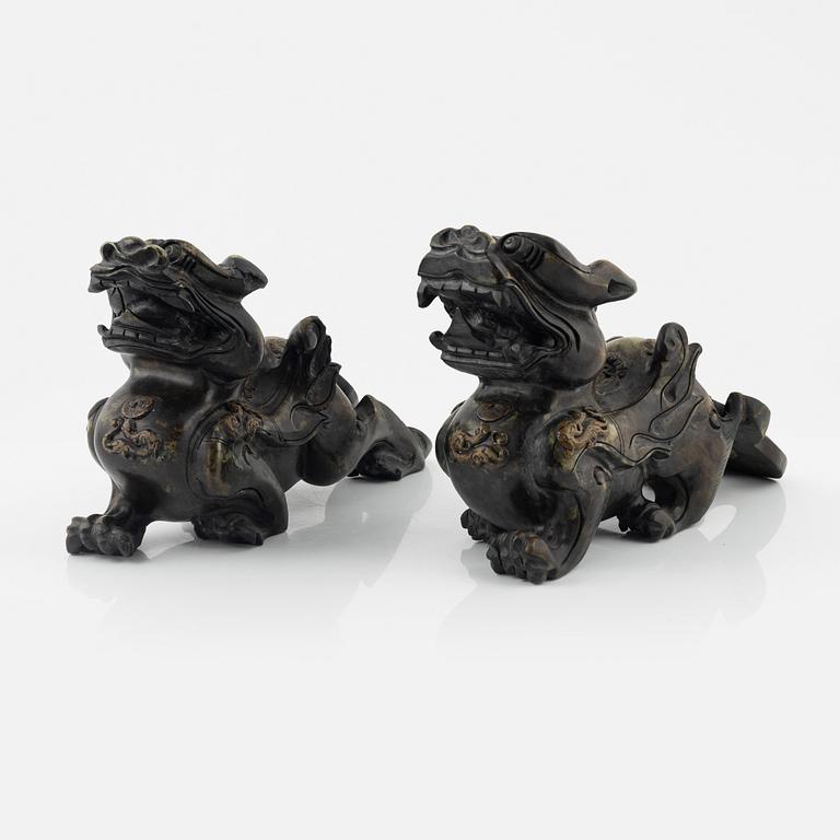 A pair of Chinese stone sculptures of mythical creatures, 20th Century.