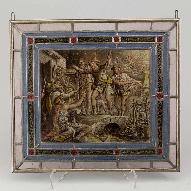 A pair of stained glass windows, circa 1900.