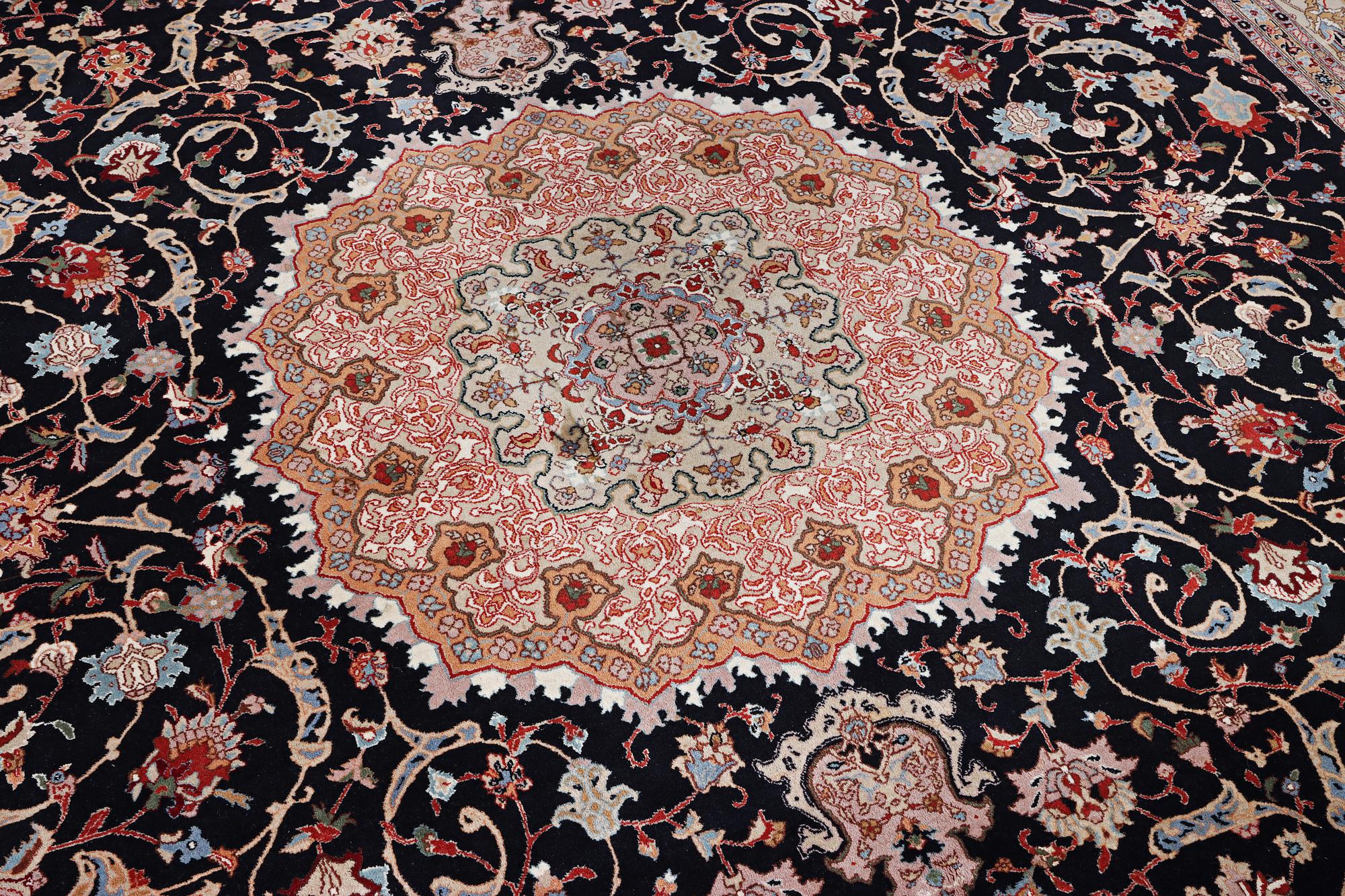 A semi.antique Tabriz carpet, 50 raj, c. 390 x 290 cm.