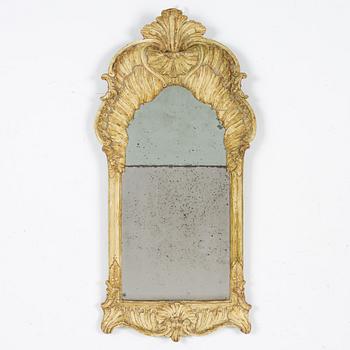 A giltwood rococo mirror, Stockholm, mid 18th century.