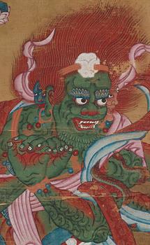 A Tibetan Thangka colour and ink on cloth laid on paper, 19th Century.