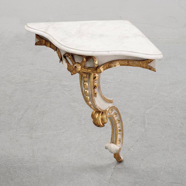 A samll console table for a corner with a wooden top.