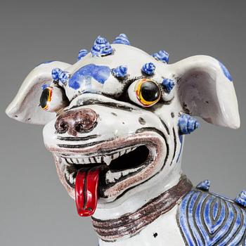 A large Chinese ceramic tile sculpture of a buddhist lion, 20th century.