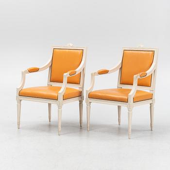 A pair of Gustavian style armchairs, end of the 20th Century.