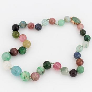 A necklace of multi-coloured stone beads with an 14K gold clasp.