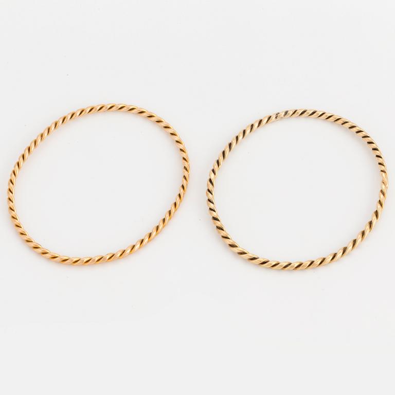 Two 14K gold bangles.