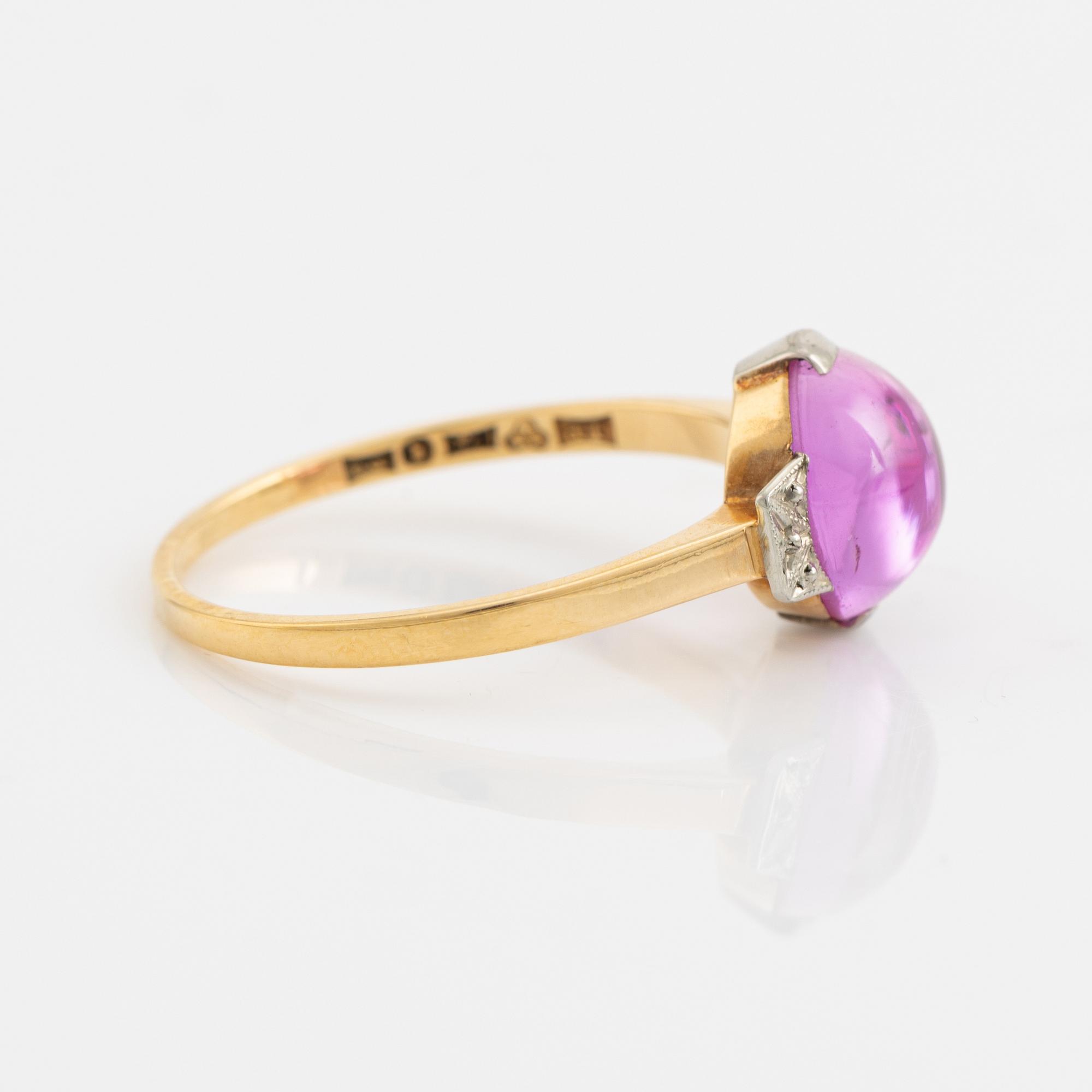 18K gold and cabochon cut syntehtic pink sapphire.