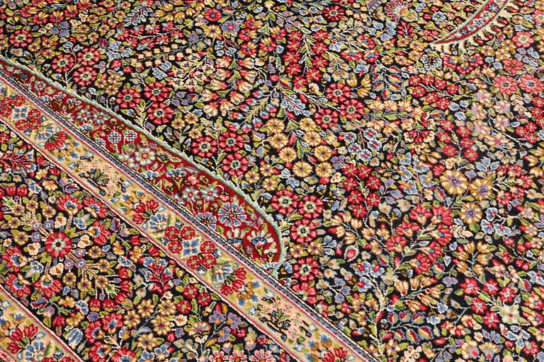 A Kerman Laver carpet, 'Millefleur', c. 392 x 300 cm.