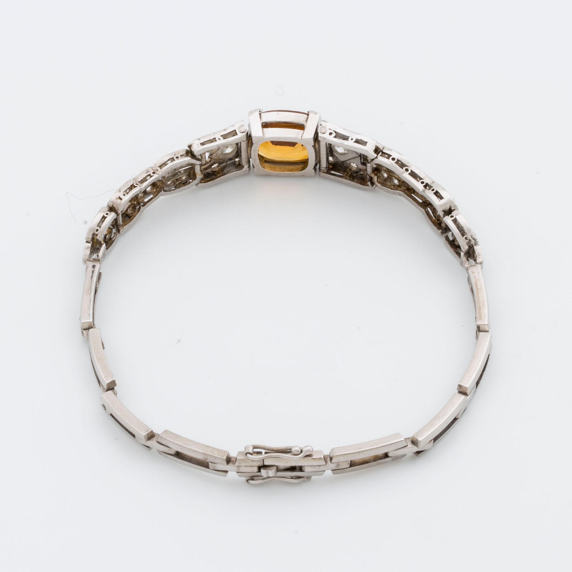 BRACELET platinum and 18K whitegold, 1 citrine, 2 old-cut and 8/8-cut diamonds approx 0,80 ct, G  Dahlgren & Co Malmö.