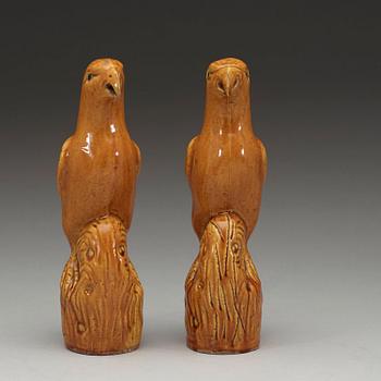 A pair of brown and yellow glazed figures of parrots, Qing dynasty, presumably 18th Century.