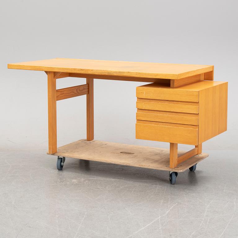 A pine writing desk by Olavi Hänninen for Nupponen, second half of the 20th Century.