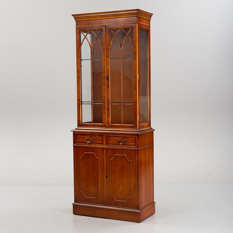 An English yew cabinet, 21st Century.