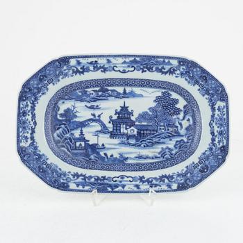 Two blue and white porcelain serving dishes and a stand for a butter tureen, China, Qianlong (1736-95).