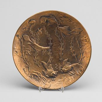 A GUNNAR NYLUND BRONZE PLATE.