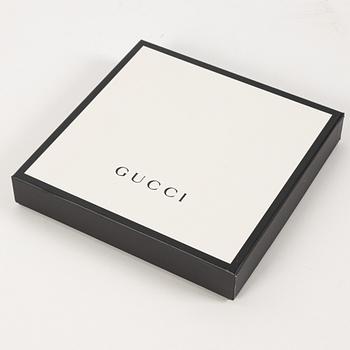 Gucci, a 'Flora' silk scarf.