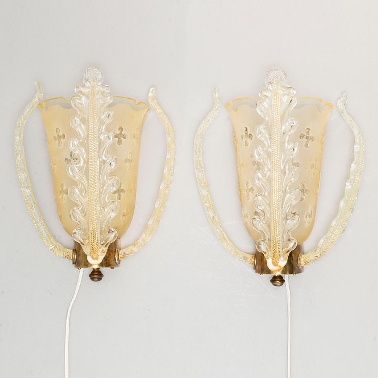 a pair of glass wall lamps from Orrefors in the mid 20th century.