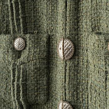 Chanel, A green bouclé jacket, french size 34.